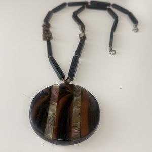 Polished wooden necklace with mother-of-peaboard. Silver crab closure 14.5 in
